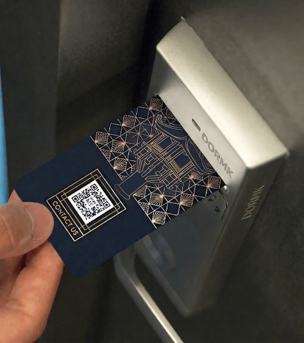 A hotel room keycard featuring a vCard Plus QR Code.